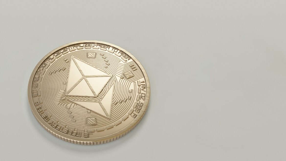 A metallic coin with the Ethereum logo on it (ie. an Ethereum token)